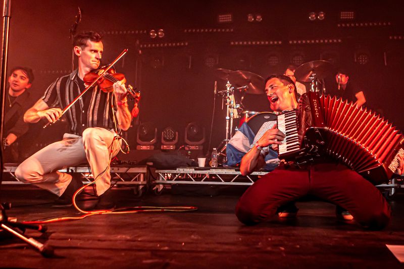 Man playing the violin and another man playing the accordion at the Hoolie in New York